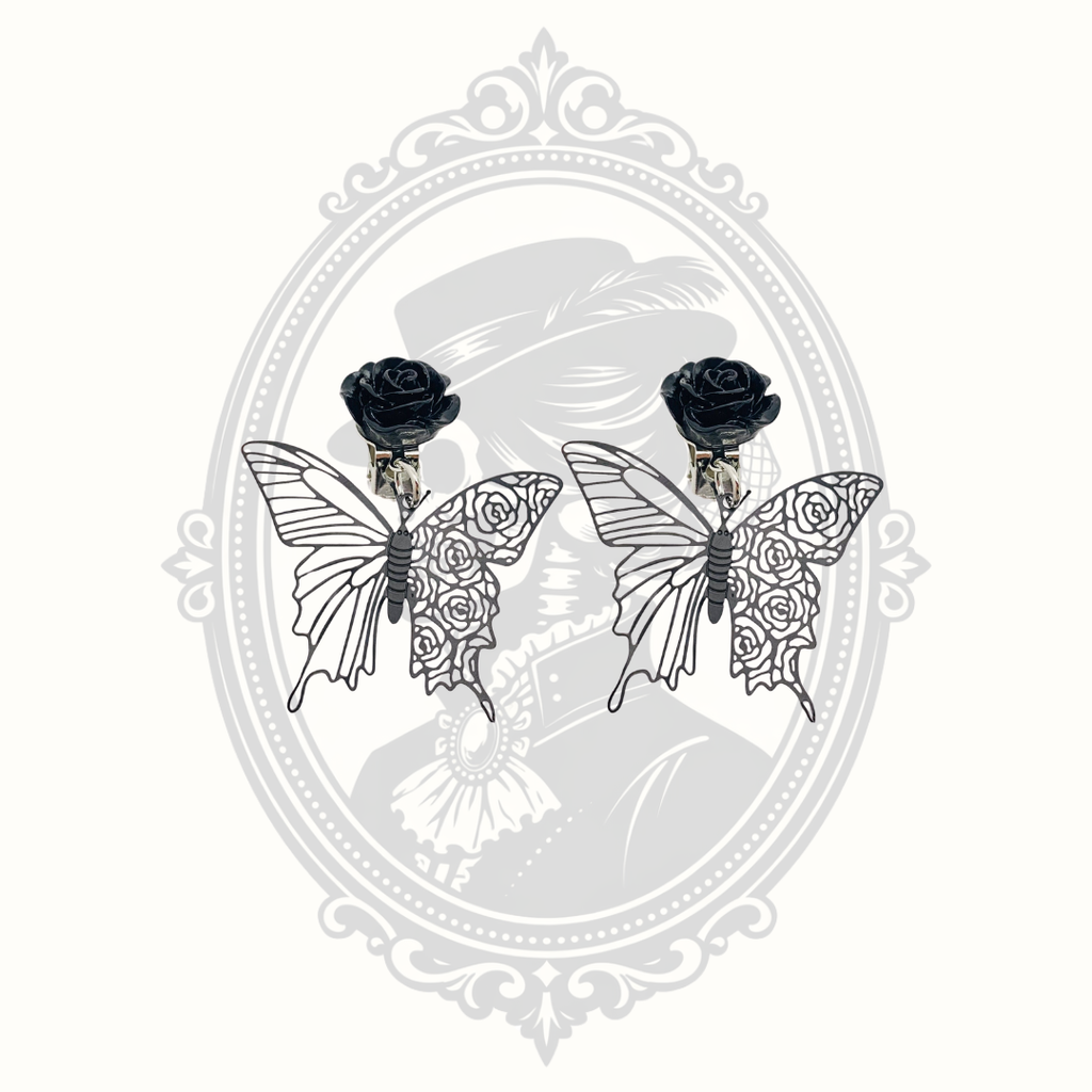 Pair of Gothic black rose butterfly clip-on earrings with intricate openwork wings.