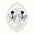 Pair of Gothic black rose butterfly clip-on earrings with intricate openwork wings.