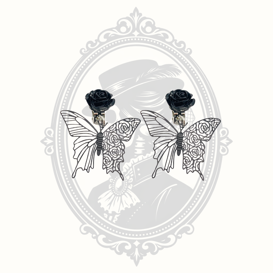 Pair of Gothic black rose butterfly clip-on earrings with intricate openwork wings.