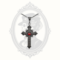 Close-up of antique gunmetal Gothic cross pendant.