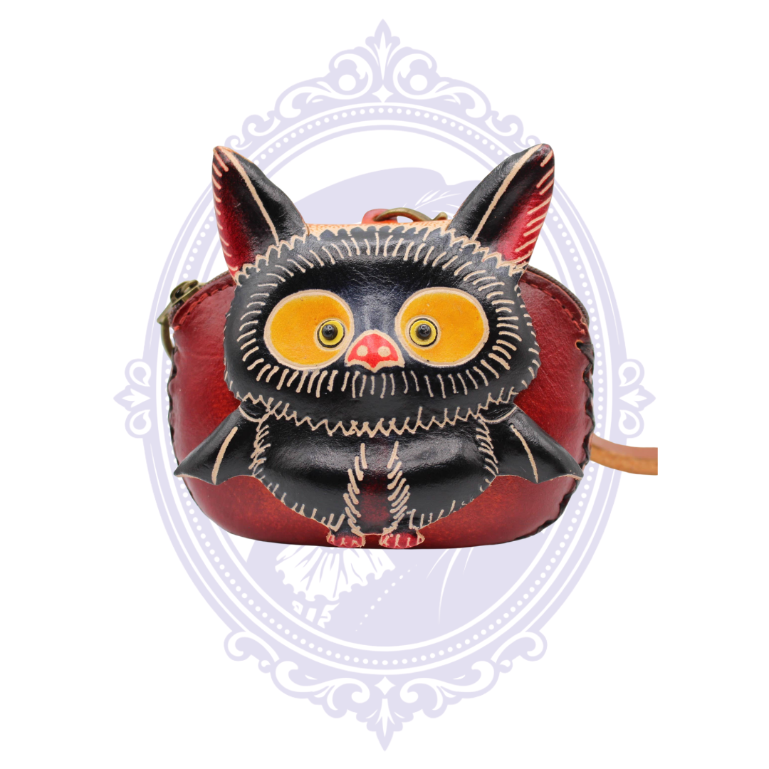 Handmade red leather coin purse wristlet with dimensional black baby bat design and large yellow eyes