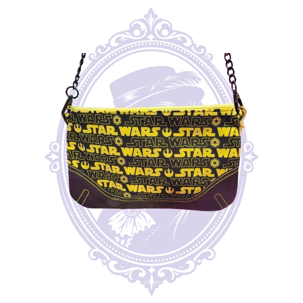 Black and yellow handmade Star Wars crossbody handbag front with repeated logo print, yellow zipper and dark lower panel