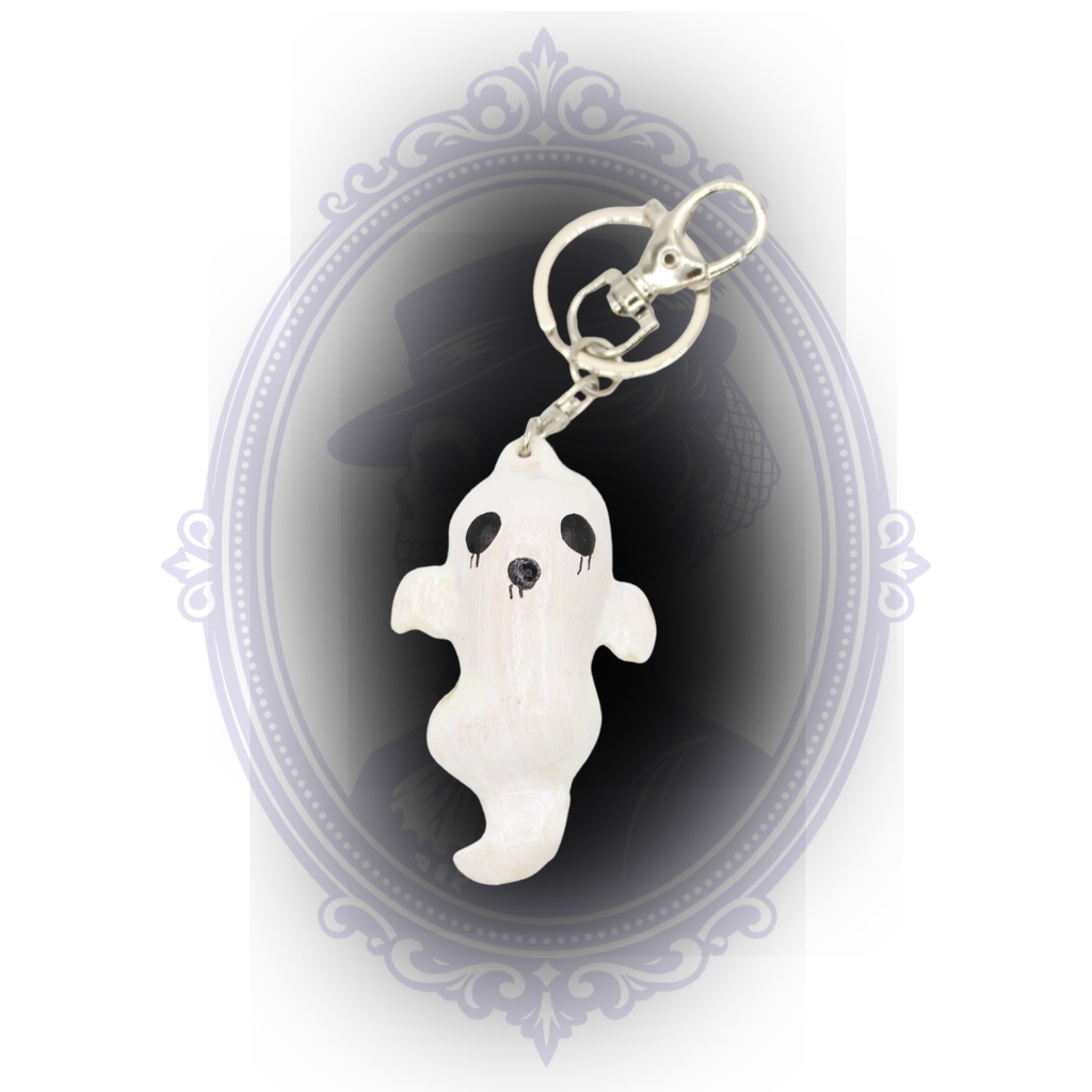Handmade white ghost keychain with hand-painted black facial details and silver-tone keyring and lobster clasp.