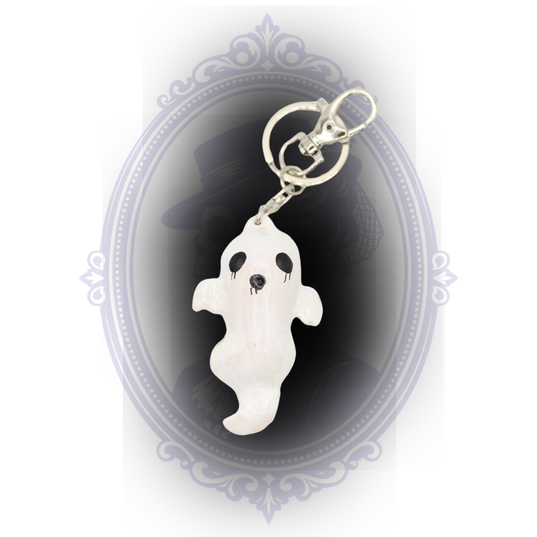 Handmade white ghost keychain with hand-painted black facial details and silver-tone keyring and lobster clasp.