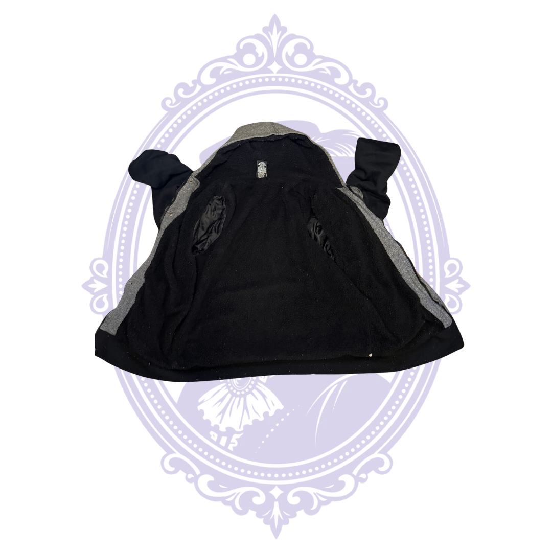 Inside-out view of HAWK boys Large hooded varsity jacket showing soft textured black polyester lining and inside construction.