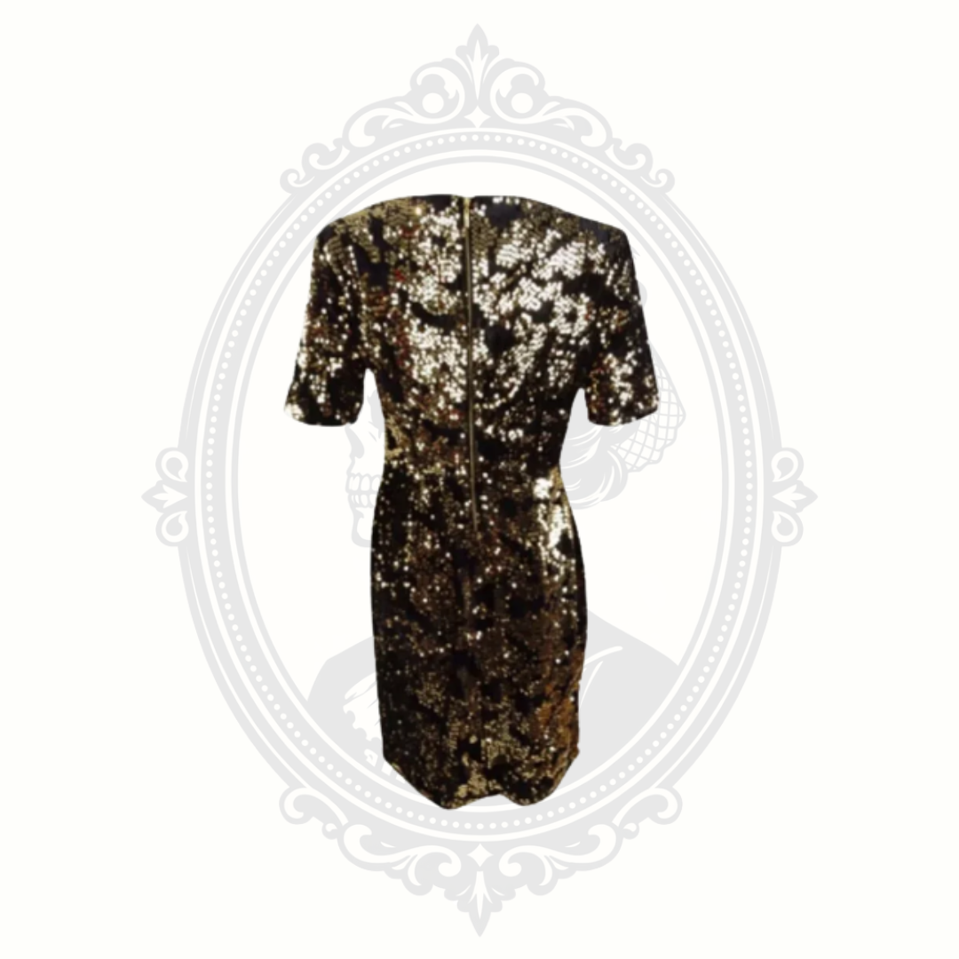 Back view of INC gold sequin sheath dress showing zipper closure and fitted silhouette with full sequin coverage.