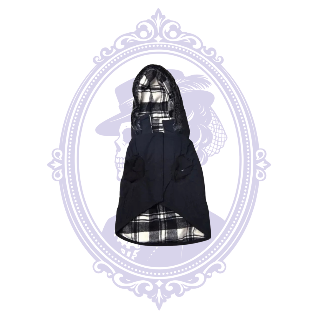 Kennedy black hooded dog coat front with faux fur trim, black and white plaid lining and front closure.