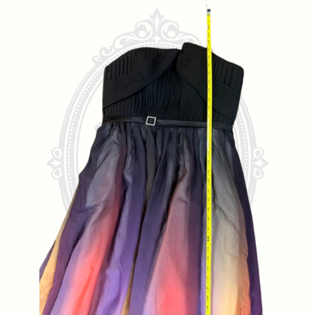 Black dress with gradient multicolor skirt, measured against a white background