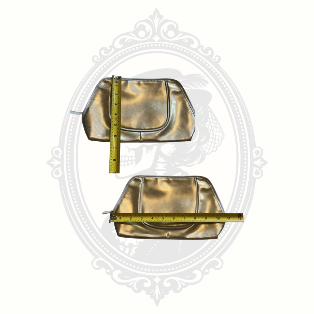 Measurement photo of gold Lancôme cosmetic bag showing size and storage capacity.