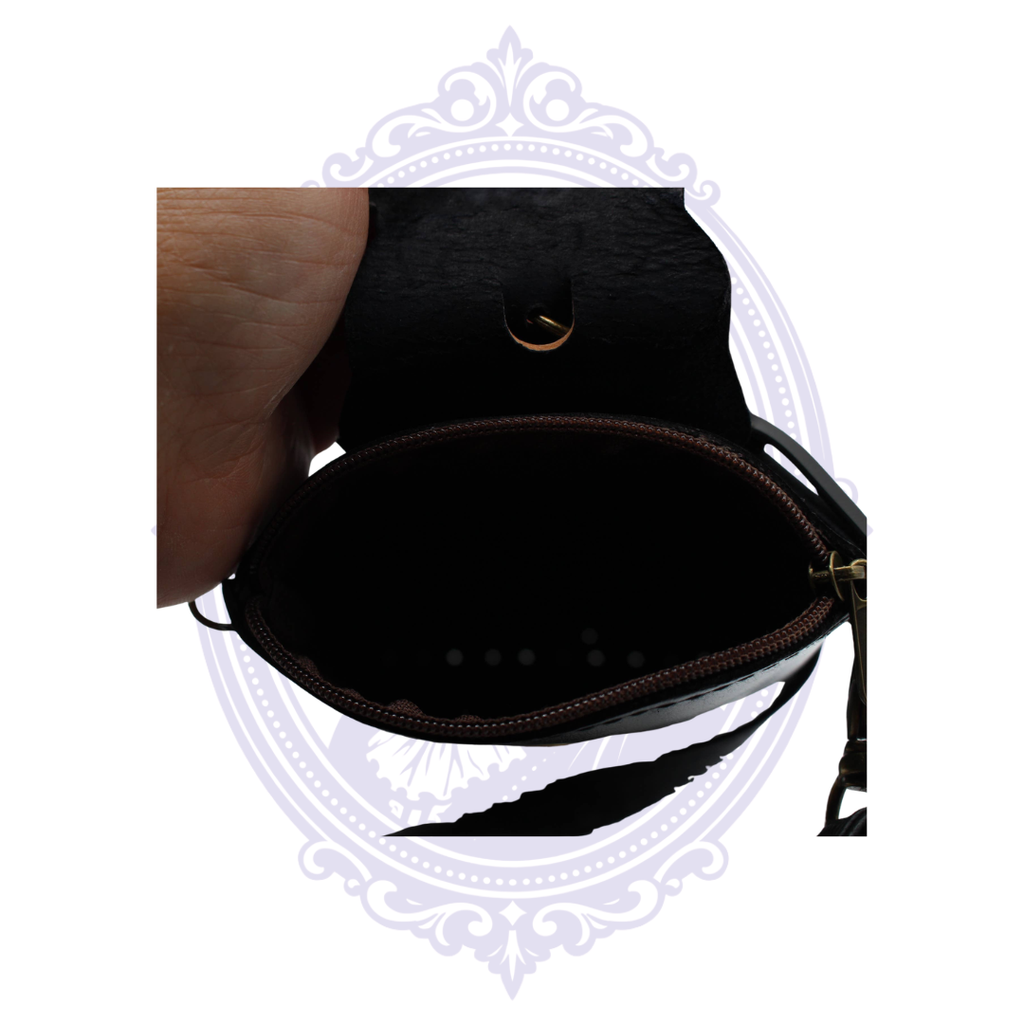 Interior view of leather sugar skull cell phone crossbody holder showing the secure zippered main compartment.