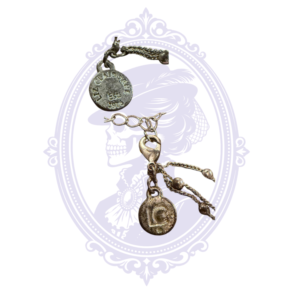 Close-up of Liz Claiborne maker tag and clasp on pre-owned silver-tone multi-strand necklace.