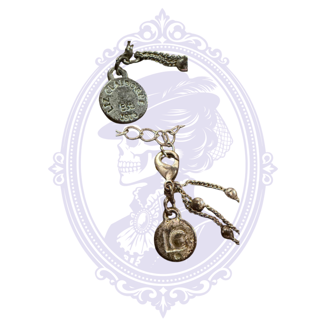 Close-up of Liz Claiborne maker tag and clasp on pre-owned silver-tone multi-strand necklace.