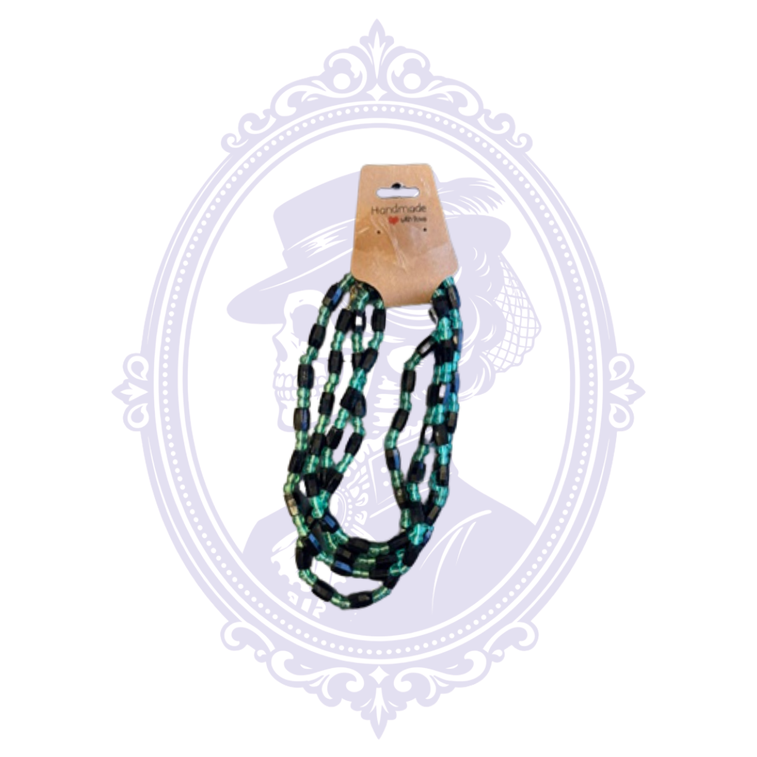 Long black and teal multi-strand beaded necklace with layered strands of rectangular black and translucent teal beads.