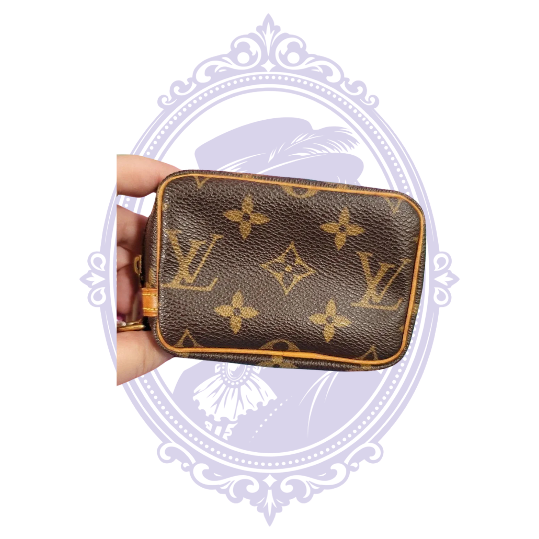 Louis Vuitton Monogram Wapity pouch, view 2 showing monogram canvas, trim, zipper, red interior or authentication tag