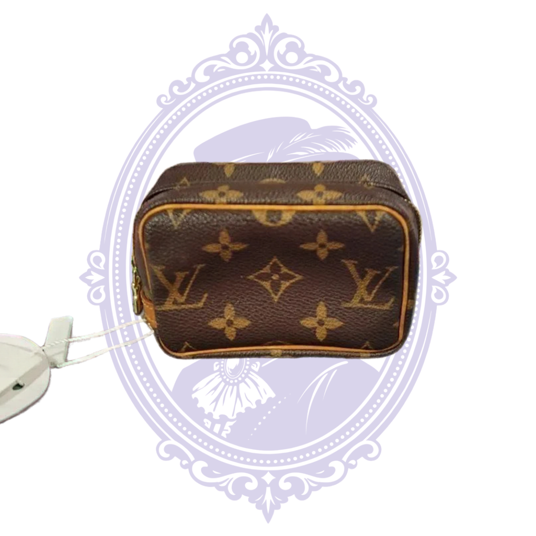 Louis Vuitton Monogram Wapity pouch, view 1 showing monogram canvas, trim, zipper, red interior or authentication tag