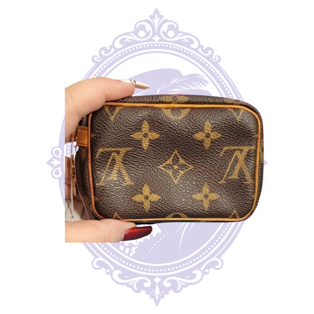 Louis Vuitton Monogram Wapity pouch, view 4 showing monogram canvas, trim, zipper, red interior or authentication tag