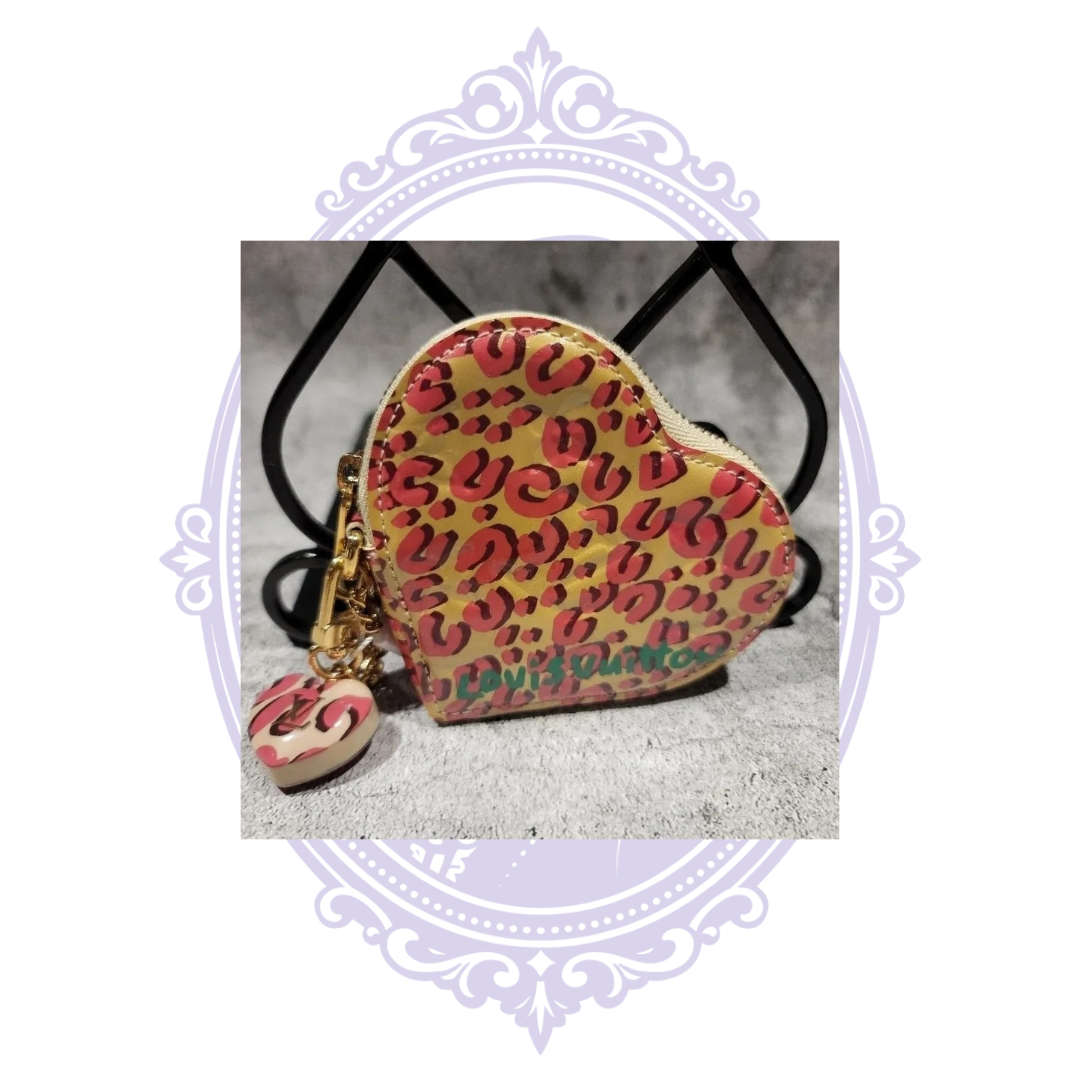 Louis Vuitton leopard Coeur coin purse with pink leopard print and matching charm