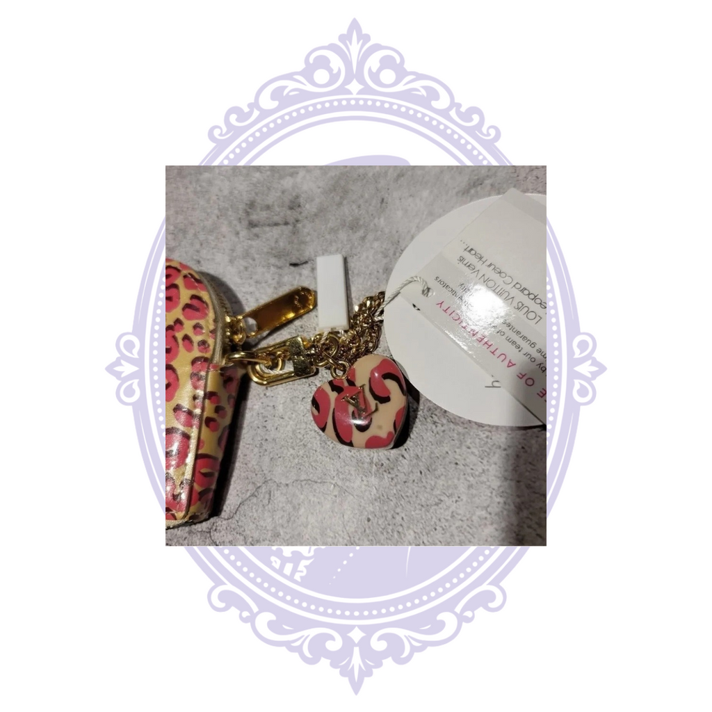 Date code TS4180 stamped inside Louis Vuitton leopard heart purse