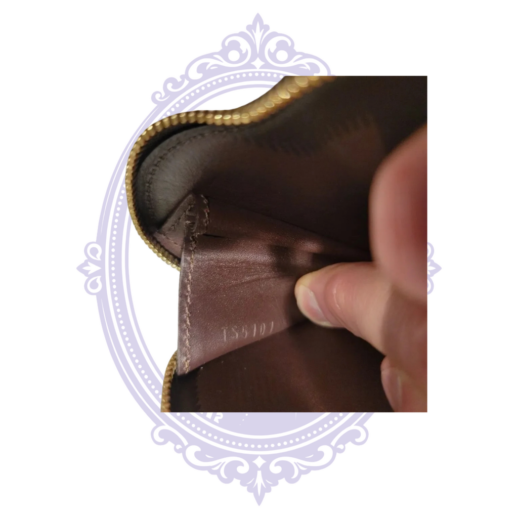 Interior of Louis Vuitton heart coin purse