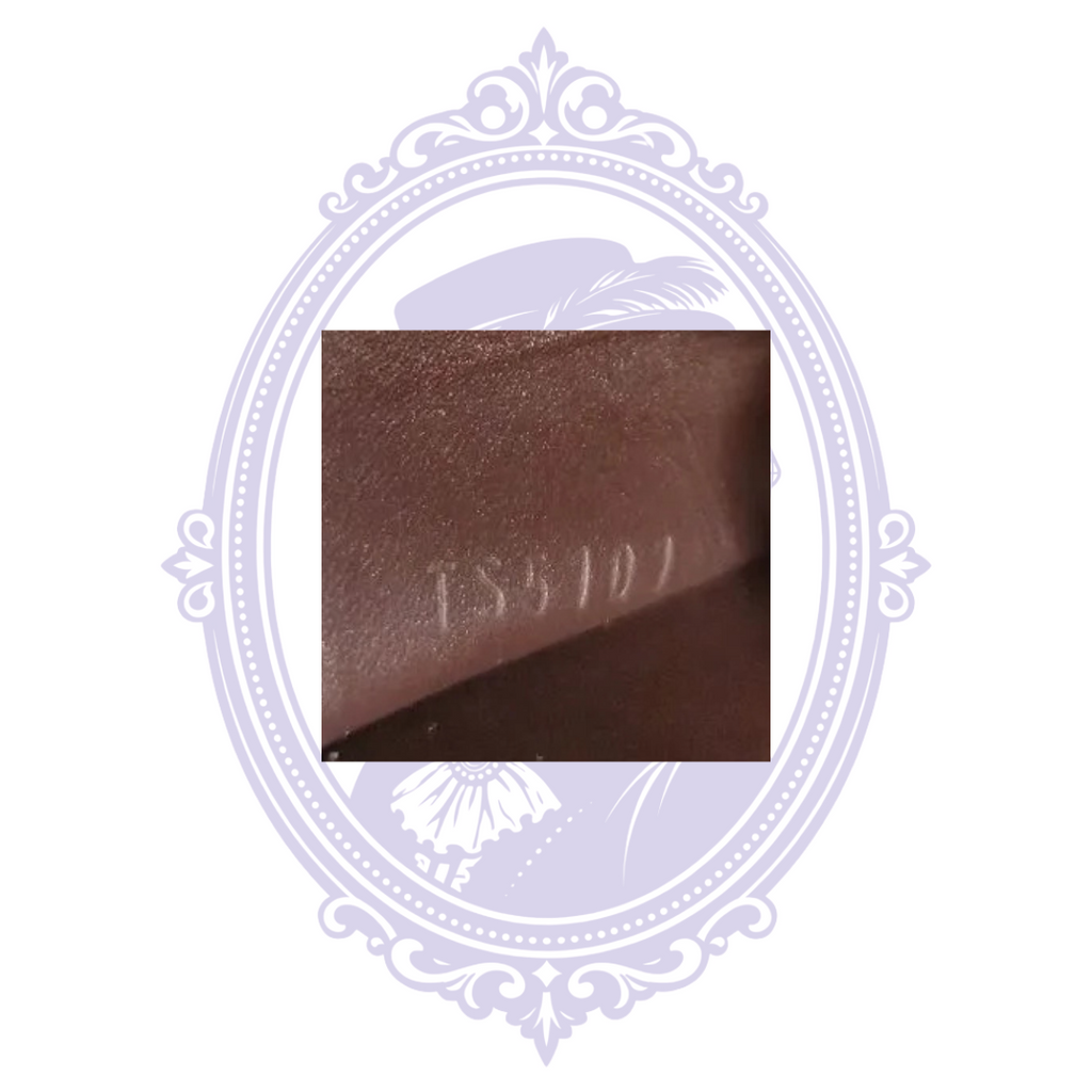 Close-up of date code inside Louis Vuitton coin purse