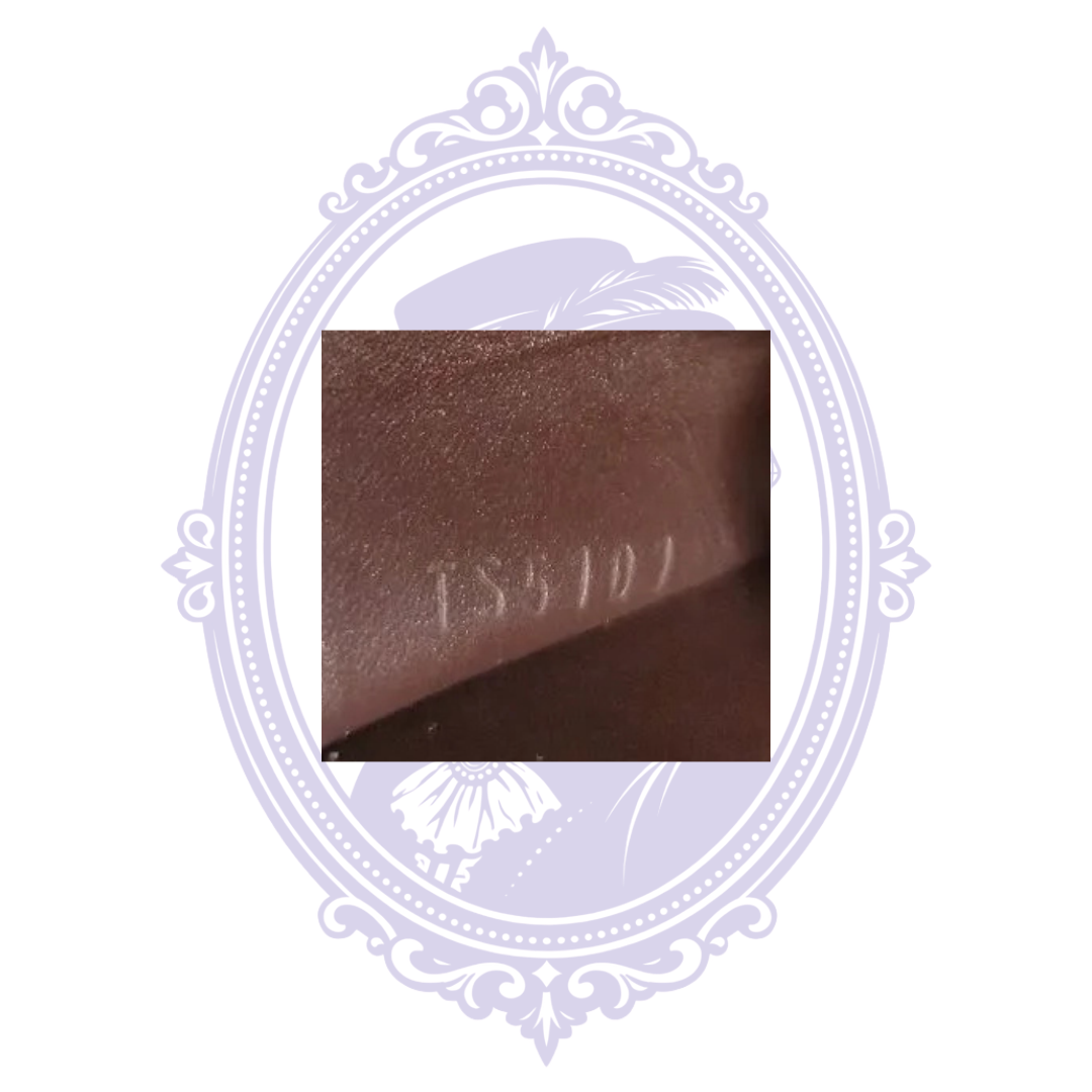 Close-up of date code inside Louis Vuitton coin purse