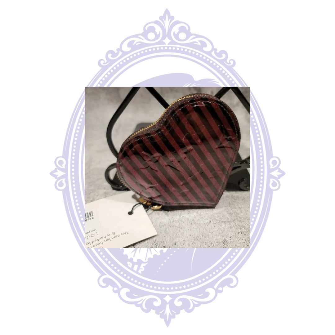 Louis Vuitton heart coin purse and attached tag