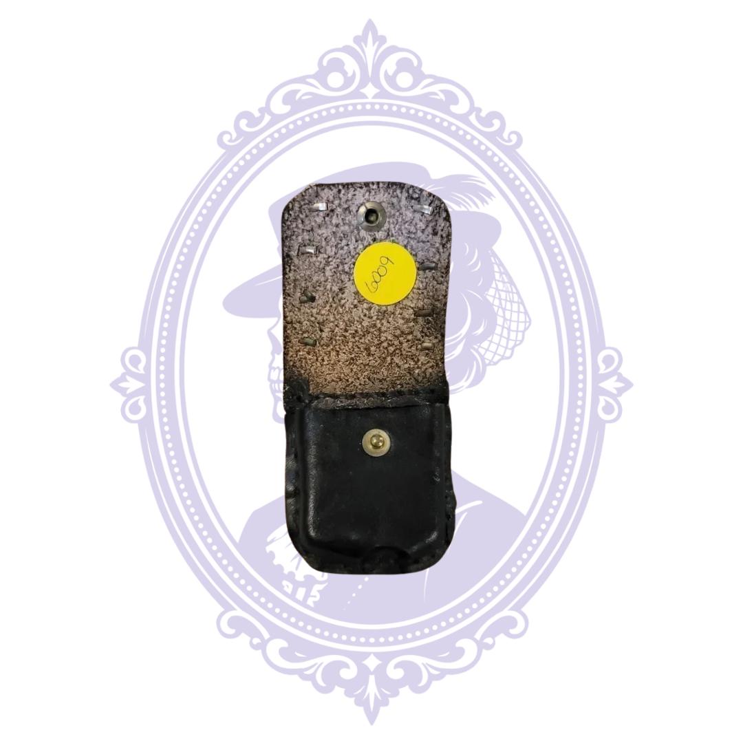 Open black leather mini pouch showing suede underside of studded flap and stock sticker 6009