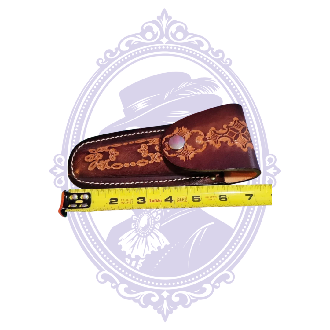 Vintage tooled leather sheath measured at approximately six inches long