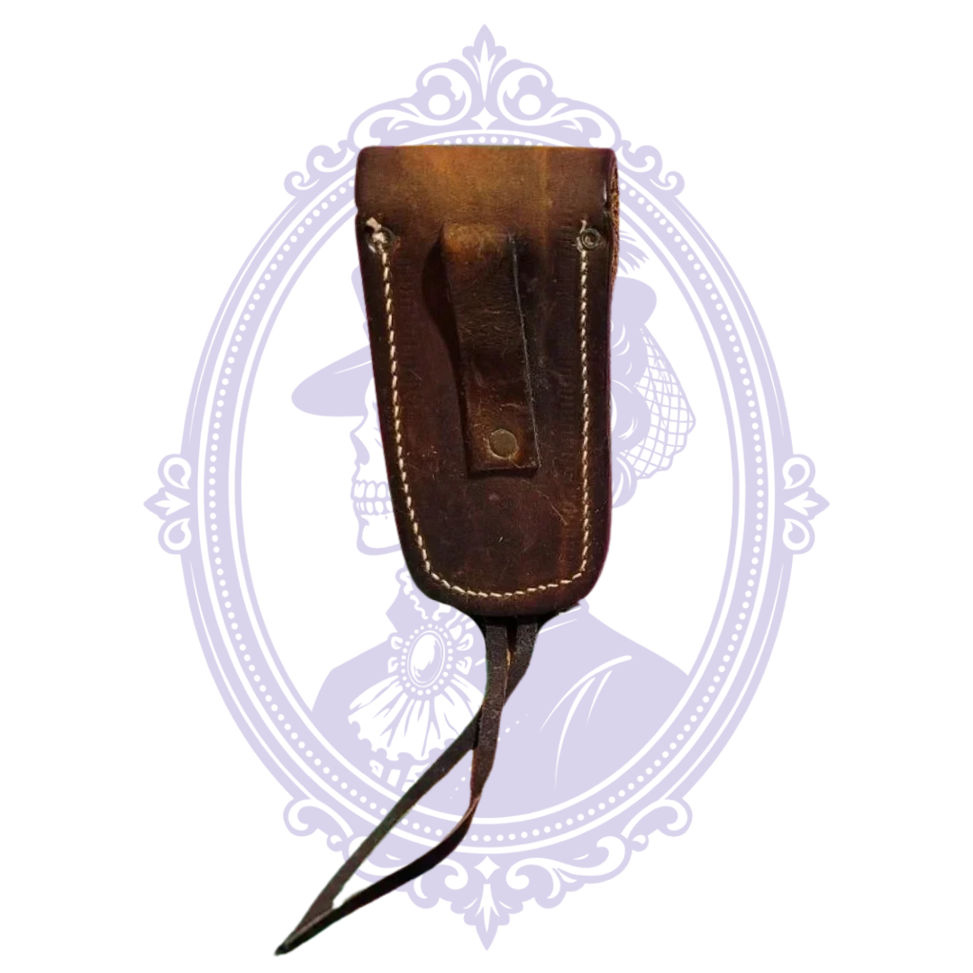 Back of vintage leather belt sheath with measuring tape showing belt loop dimensions