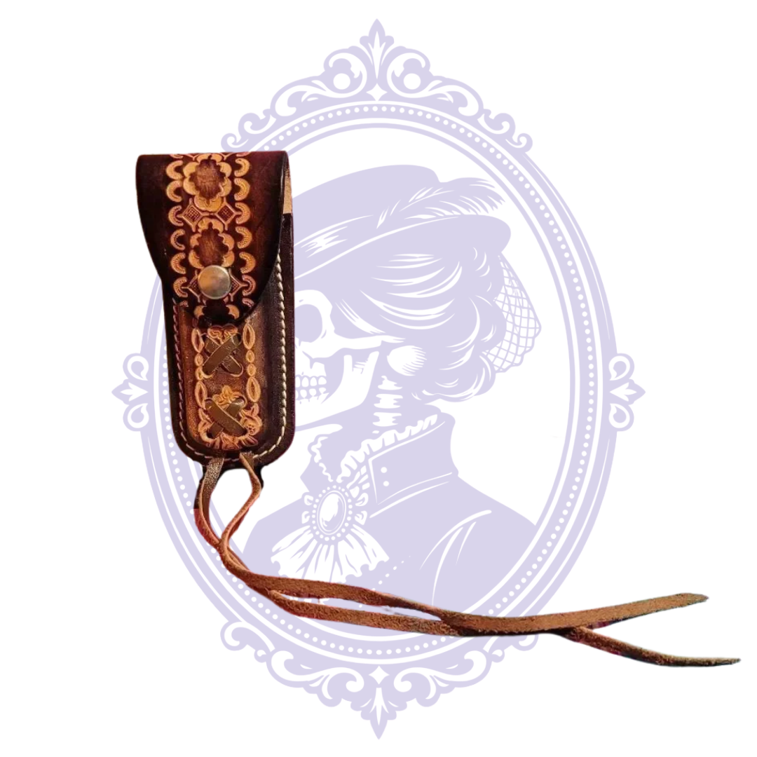 Front angled view of brown floral tooled leather belt sheath with long ties