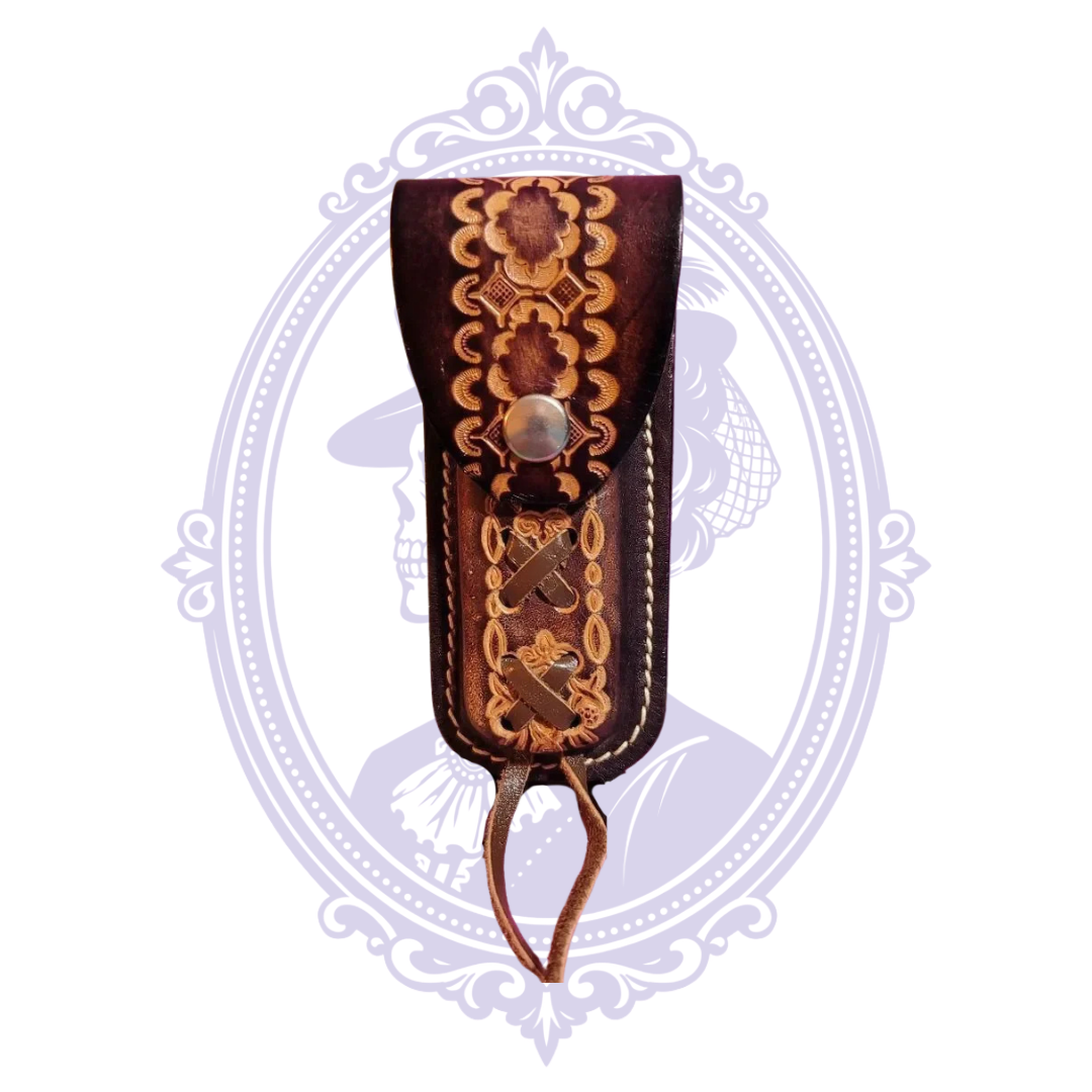 Front view of ornate brown tooled leather snap closure sheath