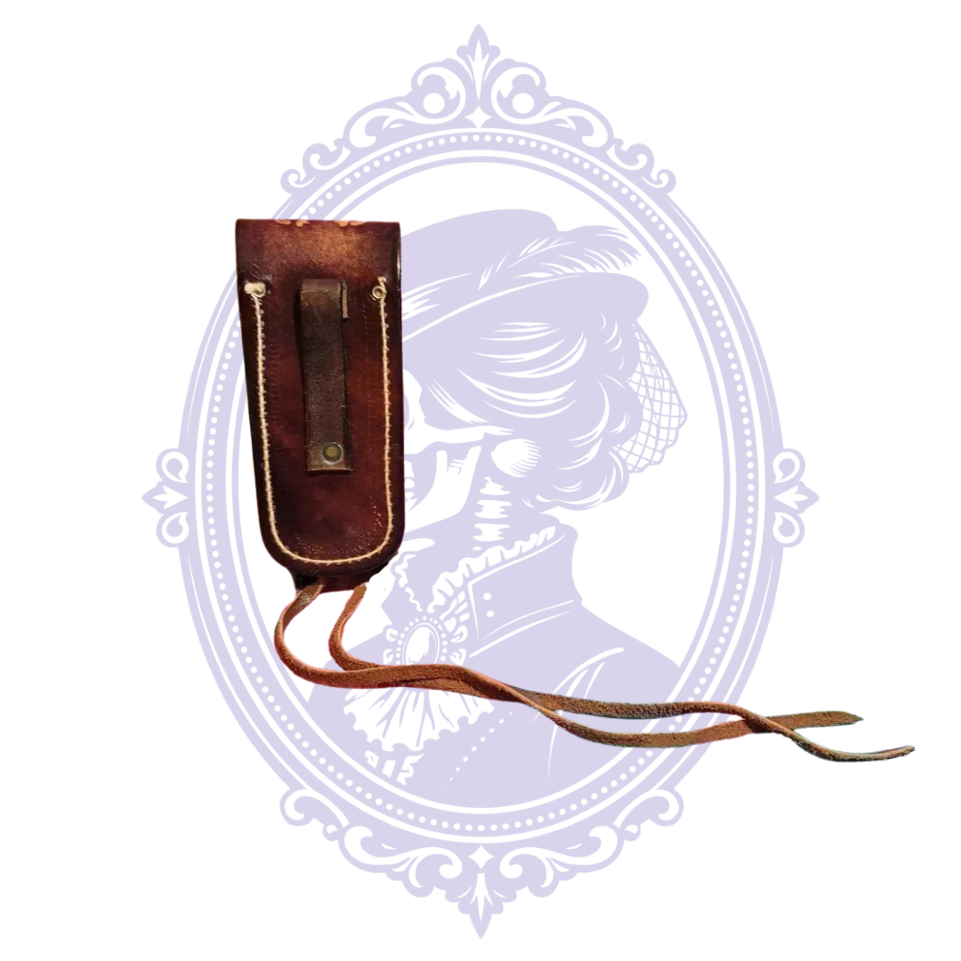 Rear view of vintage leather sheath showing belt loop and ties