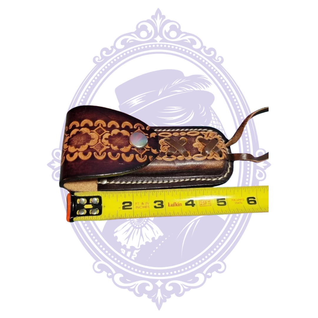 Side measurement of leather sheath approximately five inches long