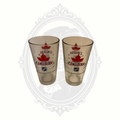 Set of two Molson Canadian NHL beer pint glasses with maple leaf logo and hockey branding.