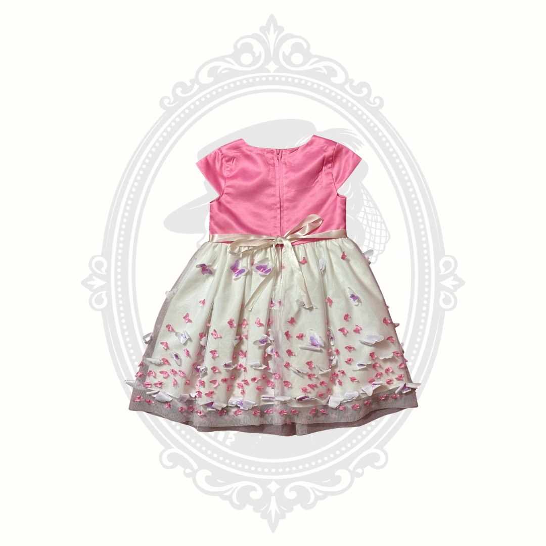 Back view of pink butterfly dress featuring layered fabric and decorative detailing.