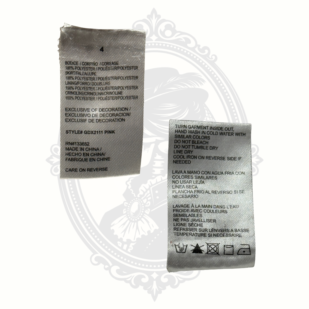 Two fabric care labels on a decorative white background
