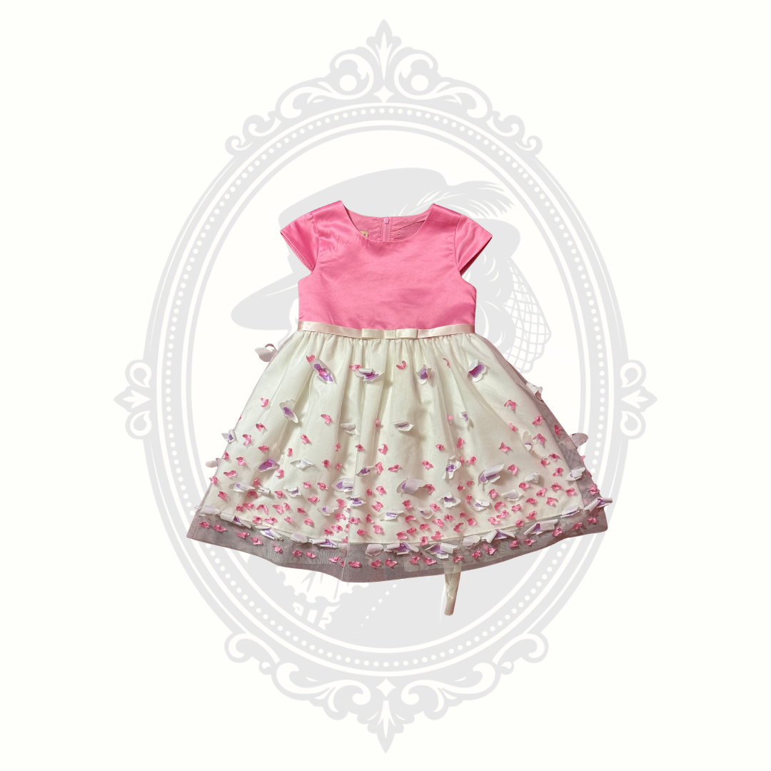 Front view of pink butterfly dress with layered skirt and whimsical feminine styling.