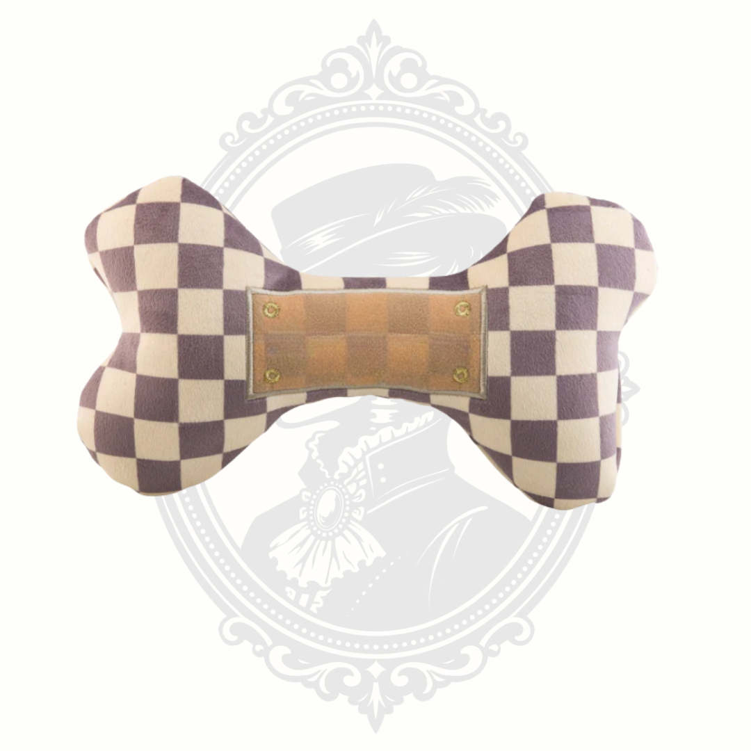 Checkered plush bone dog toy with soft texture and durable stitching for playtime