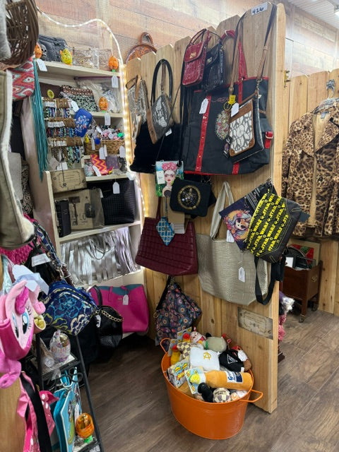 right side handbag display inside Mrs Bones Curio Cupboard with structured and statement bags