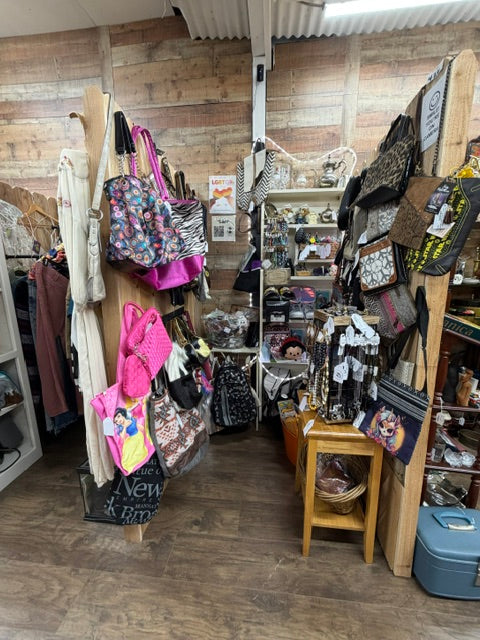 Mrs. Bones Curio Cupboard booth 426 at Treasure Trove Fleatique featuring handbags, jewelry, accessories, collectibles, and curiosities.