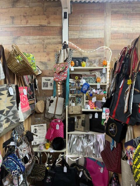 full booth display of Mrs Bones Curio Cupboard with handbags accessories and designer dog toys