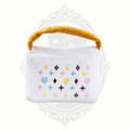 White plush dog toy handbag with colorful embroidered pattern and soft handle for interactive play