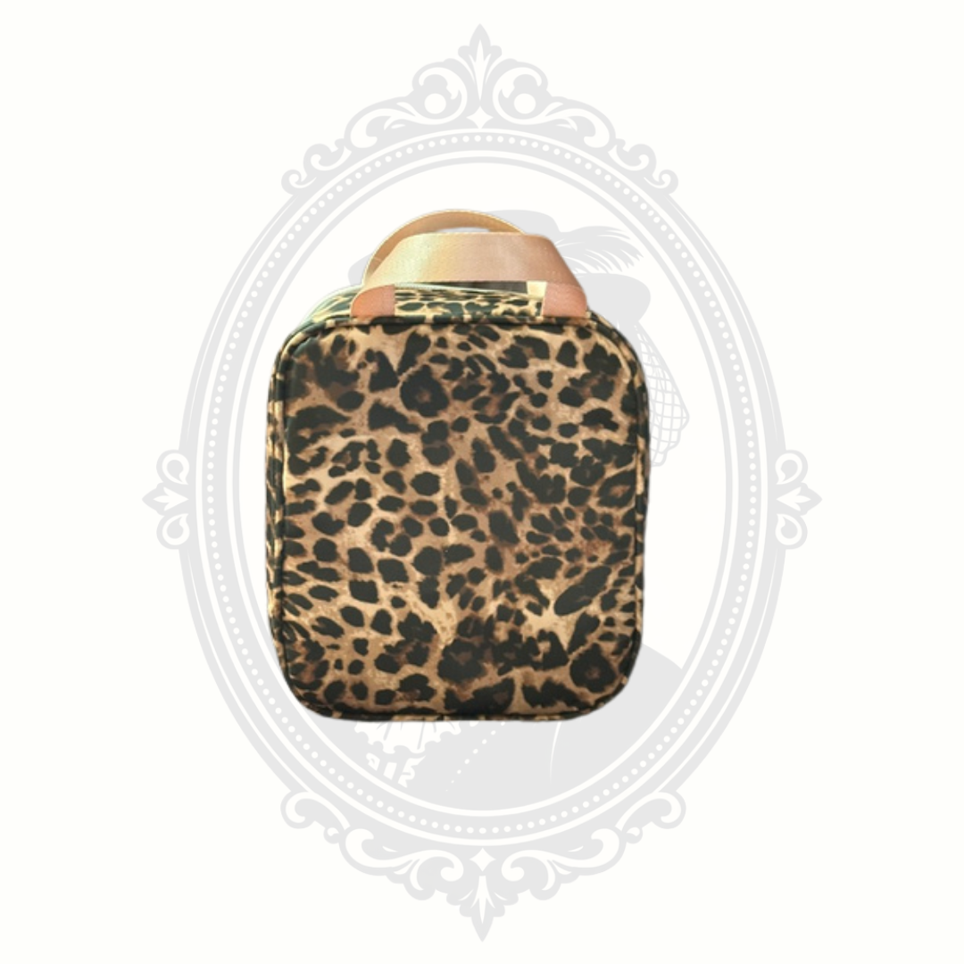 Back view of leopard print Hurley mini backpack with top handle