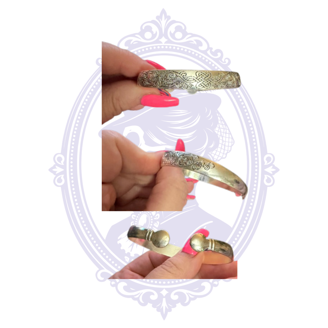 Ornate silver-tone spoon bracelet with decorative embossed design