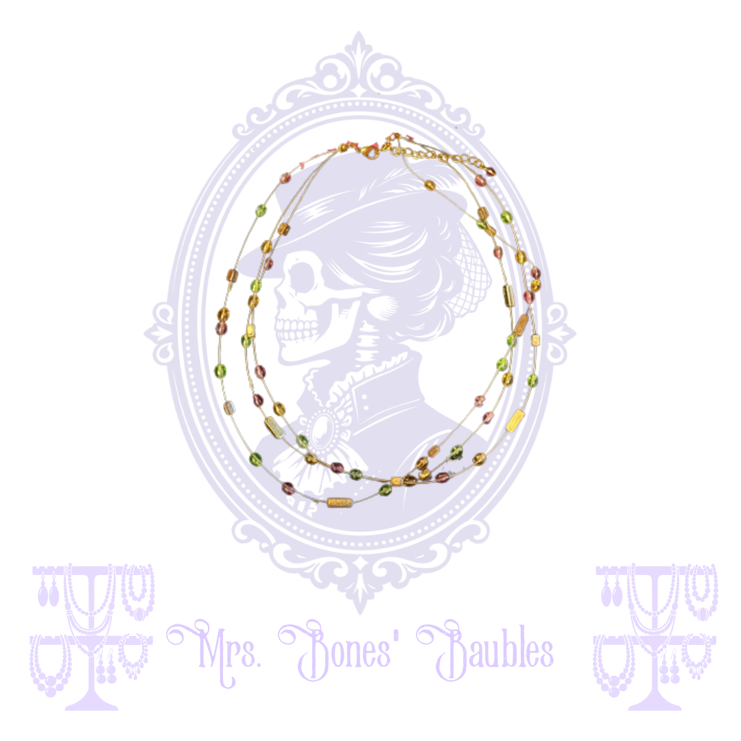 Layered gold-tone necklace with small green, amber, pink and brown beads