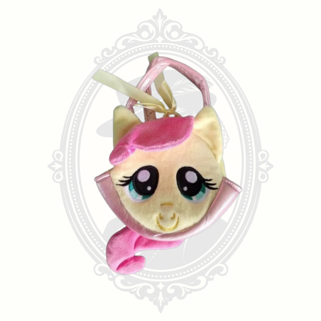 My Little Pony Fluttershy child’s plush purse in soft yellow and pink tones with character face and small carry handle.