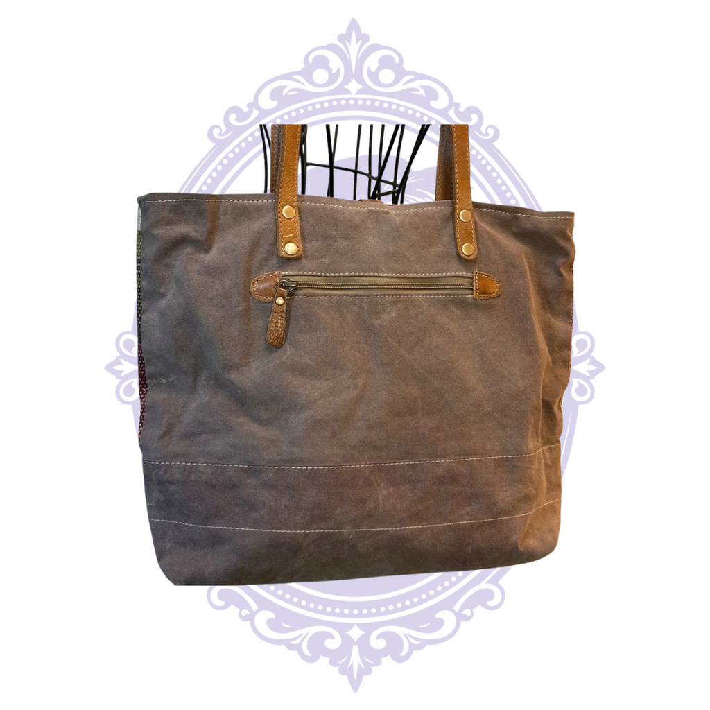 Brown canvas back with exterior zipper pocket