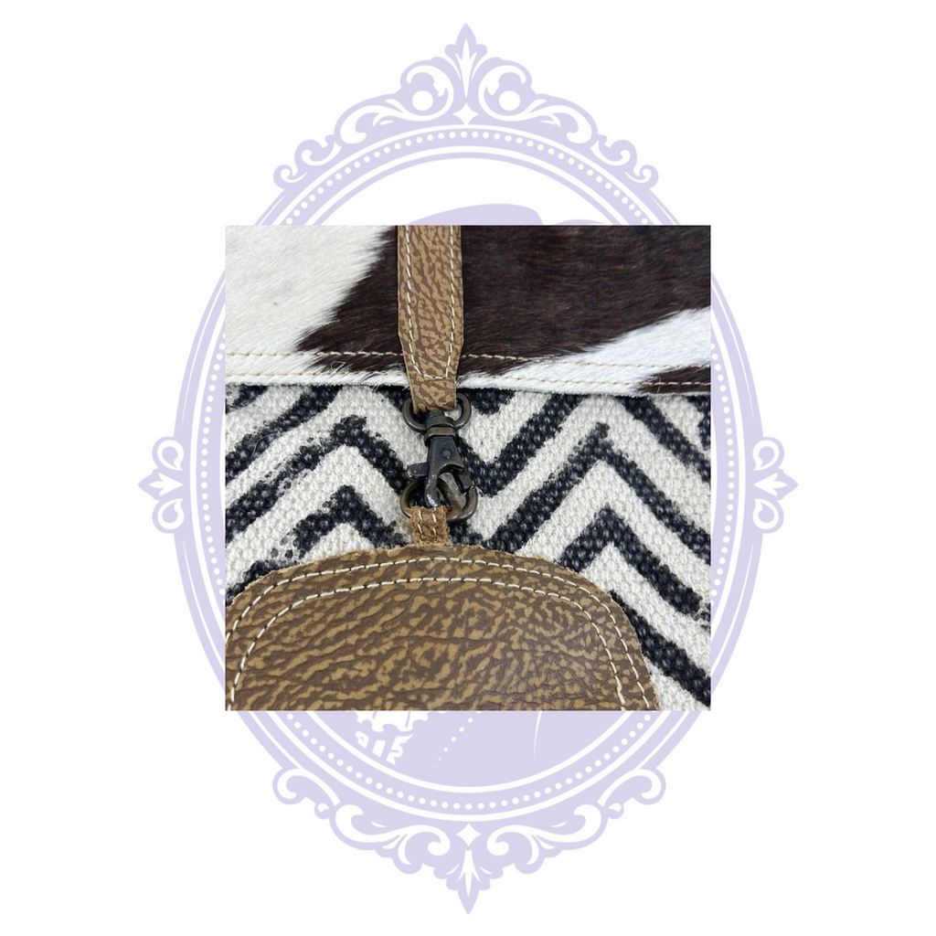 Myra Frost backpack black cream chevron exterior and cowhide pocket, width measurement