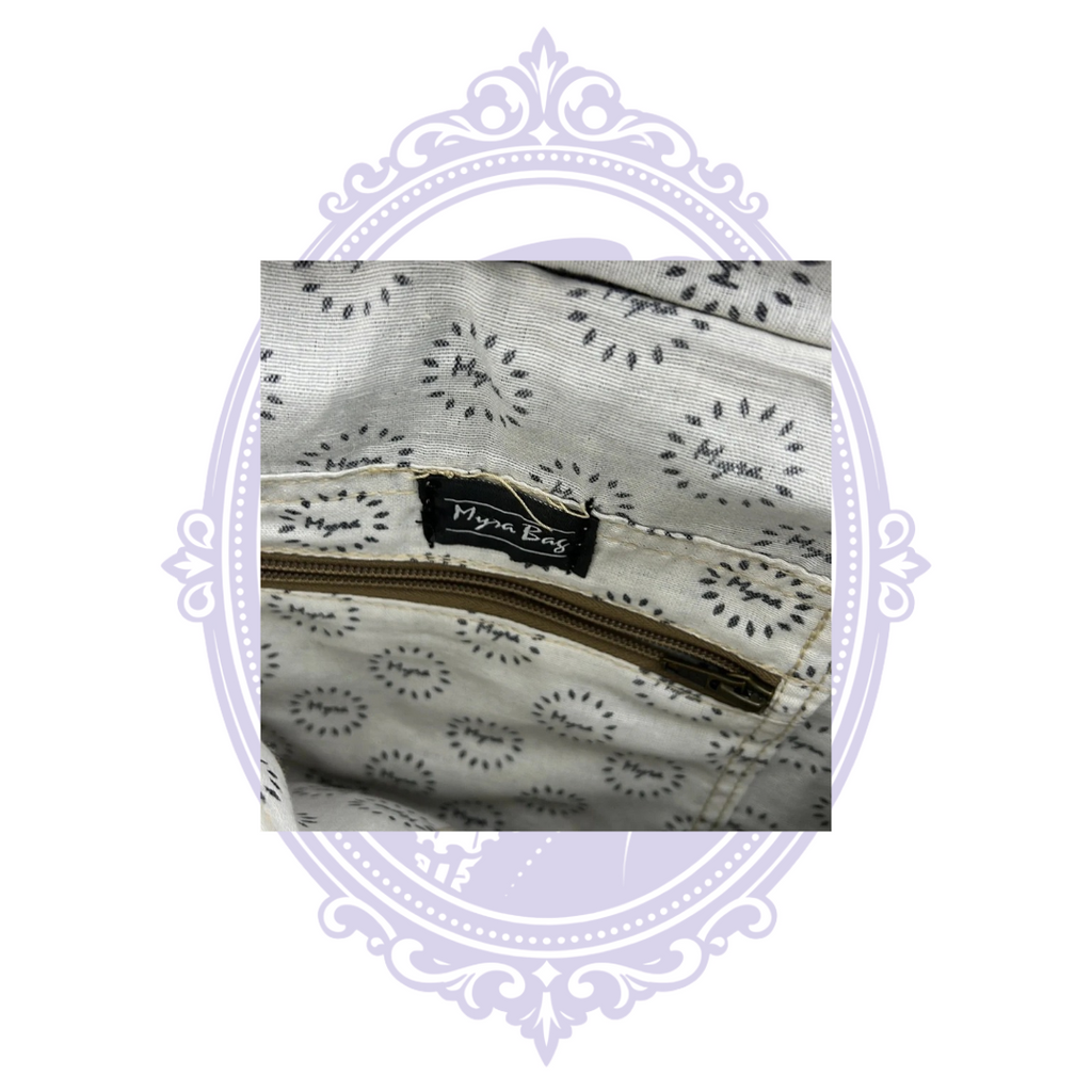 Myra Bag label and patterned interior lining with zipper pocket