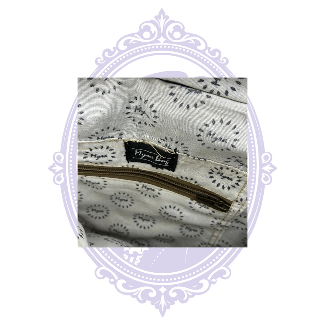 Myra Bag label and patterned interior lining with zipper pocket